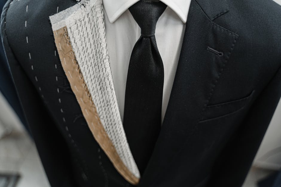 Close-up of a tailored suit in an atelier showing intricate craftsmanship.